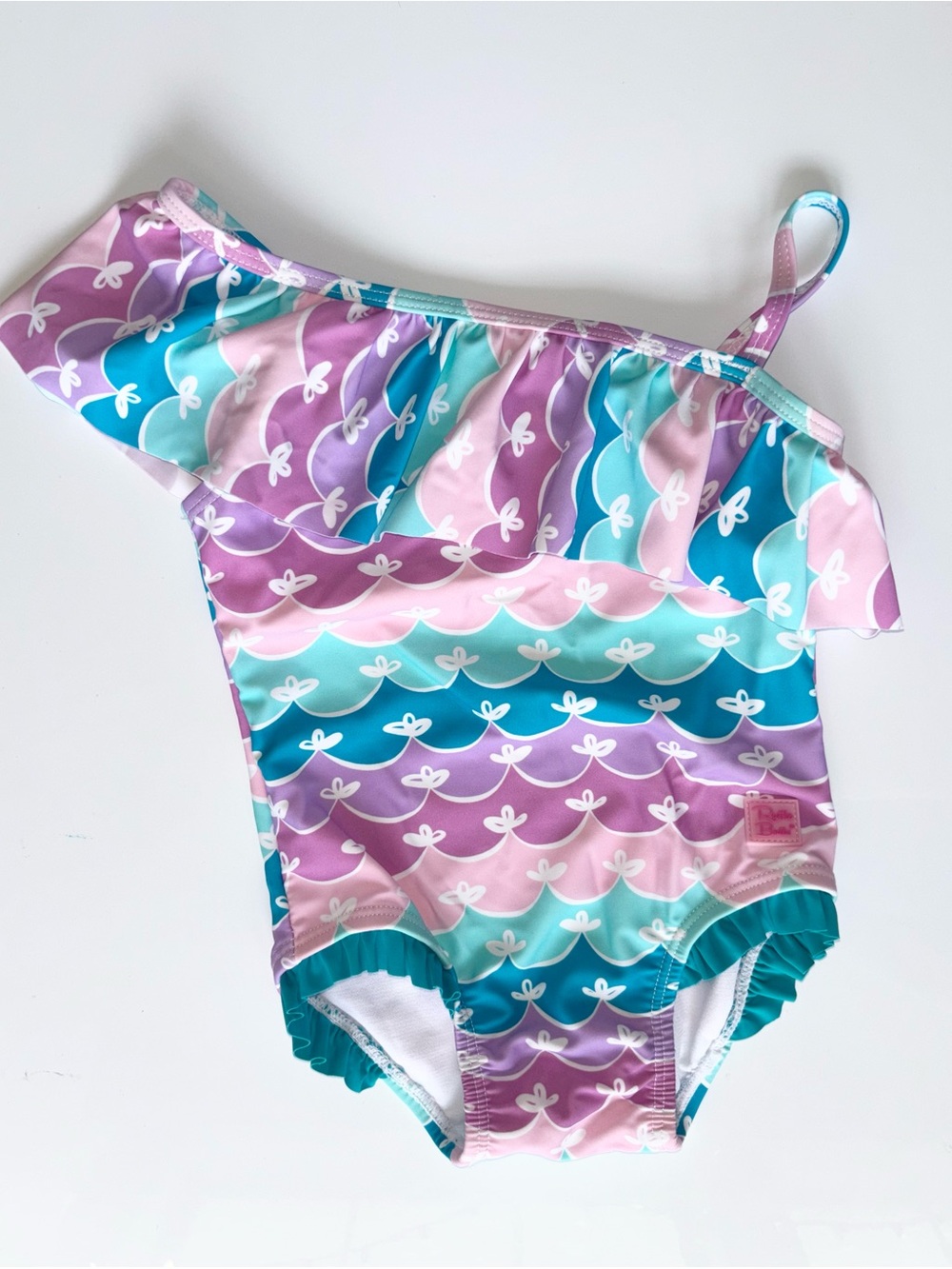 Ruffle Butts One-Shoulder Ruffle Swimsuit in Pastel Pink, Purple & Aqua